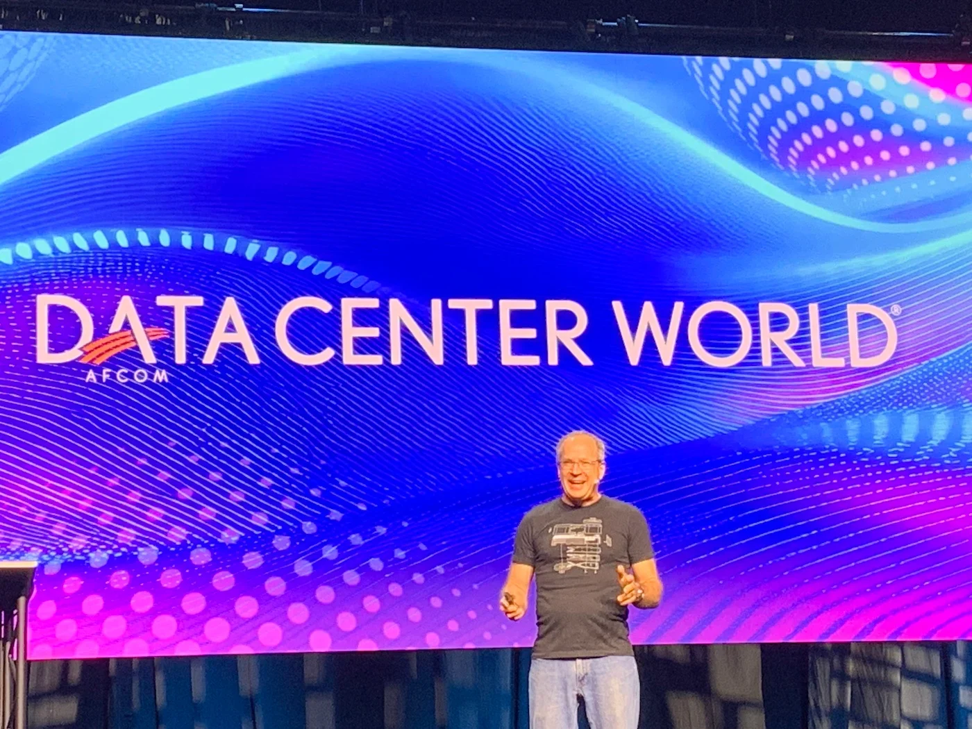 Photo from Data Center World 2025 of NVIDIA exec Wade Vinson during his keynote.
